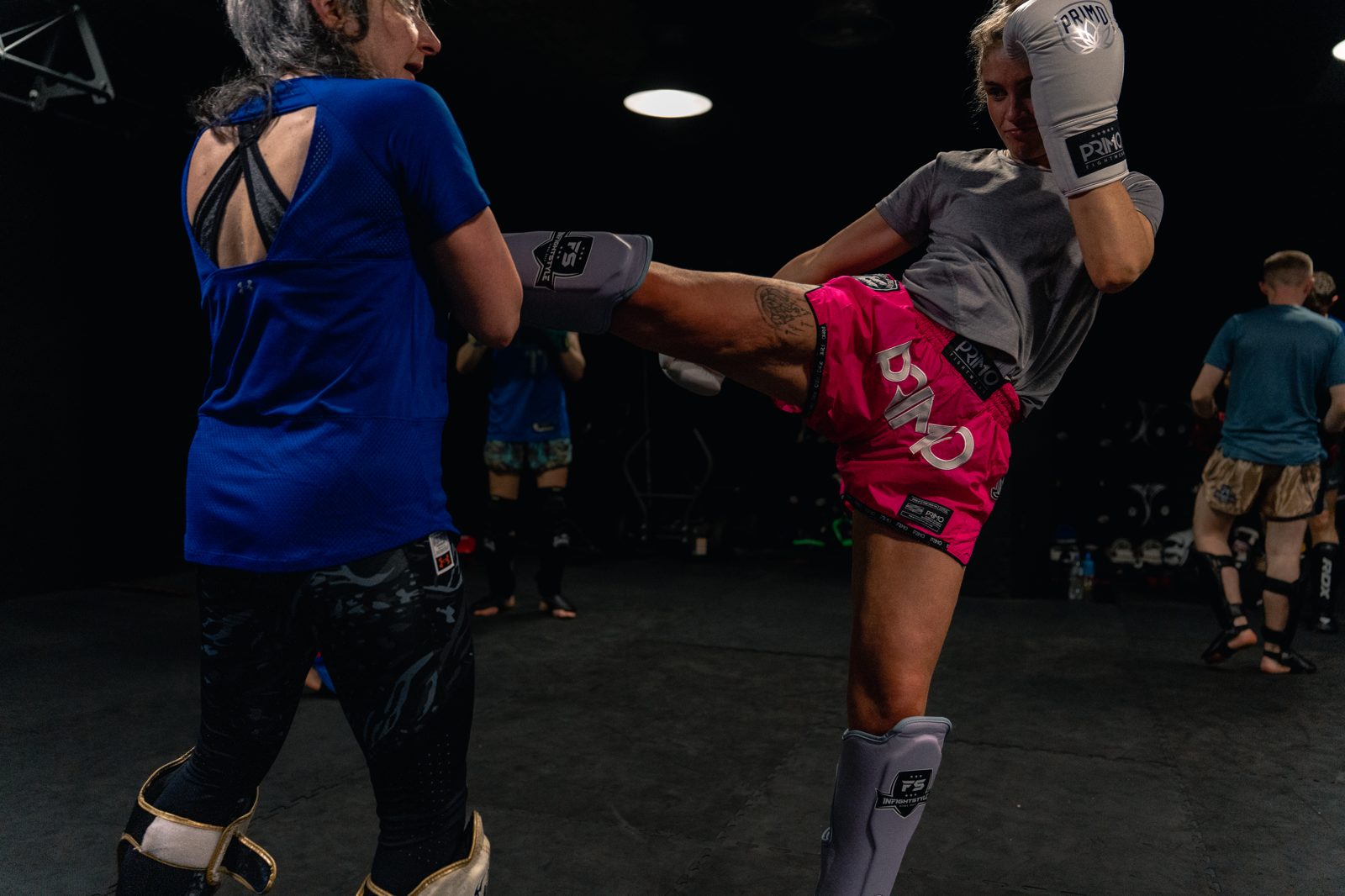 High kick during a Muay Thai class at Everyday Athlete Gym